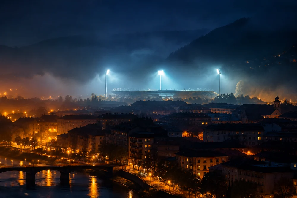 Estadio con los focos encendidos sobre la ciudad en una noche de Liga